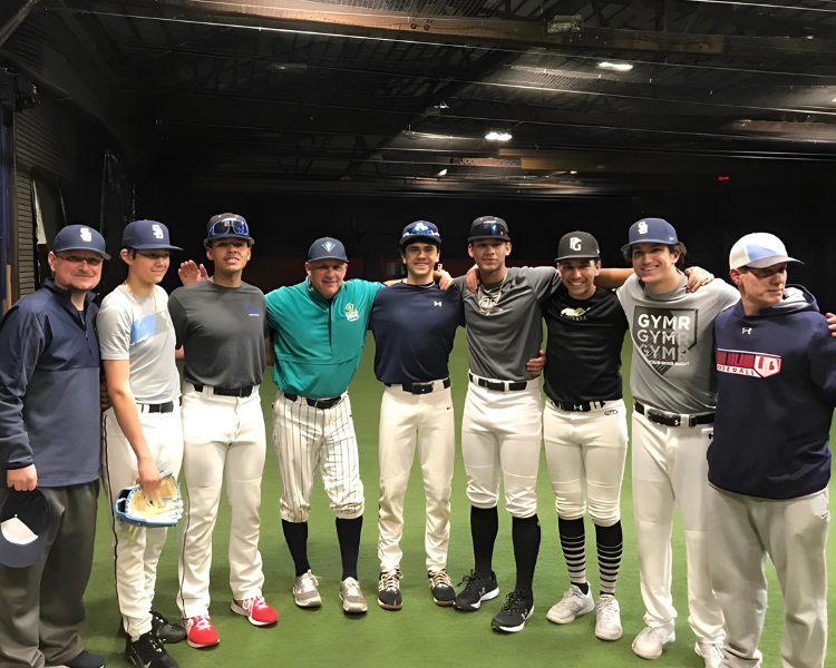 campers posing with coach trent mongero after a baseball camp